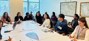 A group of people sitting around a table

AI-generated content may be incorrect.