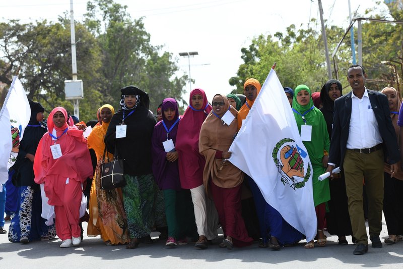 Youths march along Makka Al-Mukarama road during a peace walk to mark the International Youth Day held in Mogadishu on 12 August. Somali youth have become proactive in peace-building initiatives in various parts of the country.