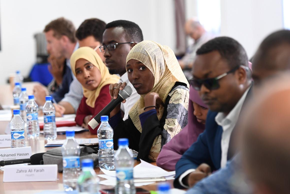 A member of the UN Youth Advisory Board asks a question during a meeting with Oscar Fernandez-Taranco, the UN Assistant Secretary-General for Peacebuilding Support, and James Swan, the UN Secretary-General’s Special Representative for Somalia, in Mogadish