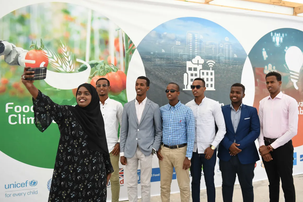 A participant takes a selfie with her friends at the Mogadishu Tech Summit in Somalia on 21 November 2019. UN Photo / Ilyas Ahmed